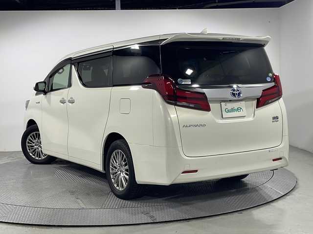 トヨタ アルファードハイブリット G 広島県 2019(令1)年 3.5万km ラグジュアリーホワイトパールクリスタルシャインガラスフレーク 白革シート/JBLプレミアムサウンド/パノラミックビューモニター/ALPINE12.8型フリップダウンモニター/純正9型ナビ（フルセグTV/Bluetooth）/3眼LEDヘッドランプ/デジタルインナーミラー/パワーバックドア/パワーシート/ポジションメモリー/シートヒーター/ベンチレーション/セーフティセンス/・プリクラッシュセーフティ/・レーントレーシングアシスト/・アダプティブハイビーム/・レーダークルーズコントロール/クリアランスソナー/ブラインドスポットモニター/ETC2.0/ドライブレコーダー/USB入力端子