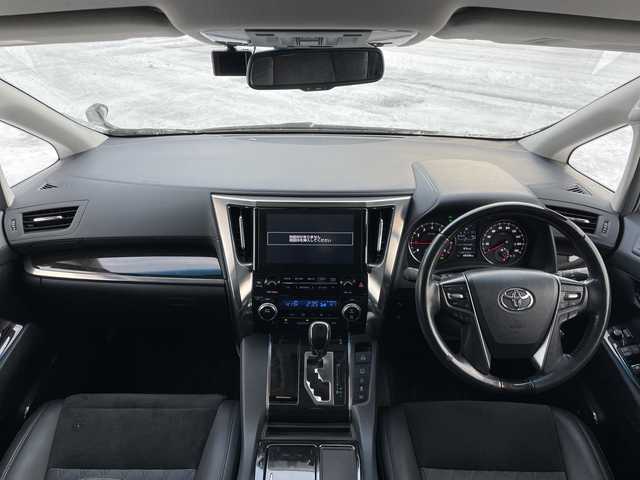 トヨタ アルファード S Cパッケージ 道央・札幌 2015(平27)年 6.9万km グレーメタリック ４WD/JBLプレミアムサウンド/純正メモリーナビ/AM/FM/BT/SD/CD/フルセグ/純正フリップダウンモニター/トヨタセーフティセンス/衝突被害軽減ブレーキ/横滑り防止装置/レーダークルーズコントロール/レーンキープアシスト/パーキングアシスト/クリアランスソナー/バックカメラ/ビルトインETC/ドライブレコーダー/アイドリングストップ/ECOMODE/両側パワースライドドア/パワーバックドア/前席/2列目パワーシート/D席メモリーシート/N席/2列目オットマン/ハーフレザーシート/革巻きウッドコンビステアリング/ステアリングリモコン/ハンドルヒーター/AC100V/電動パーキング/ブレーキホールド/自動防眩ミラー/MTモード付AT/プッシュスタート/スマートキー/LEDヘッドライト/オートライト/フォグランプ/電動格納ミラー/ウィンカーミラー/純正フロアマット/ドアバイザー/スペアキー