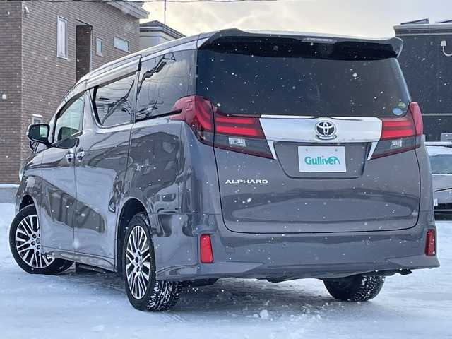 トヨタ アルファード S Cパッケージ 道央・札幌 2015(平27)年 6.9万km グレーメタリック ４WD/JBLプレミアムサウンド/純正メモリーナビ/AM/FM/BT/SD/CD/フルセグ/純正フリップダウンモニター/トヨタセーフティセンス/衝突被害軽減ブレーキ/横滑り防止装置/レーダークルーズコントロール/レーンキープアシスト/パーキングアシスト/クリアランスソナー/バックカメラ/ビルトインETC/ドライブレコーダー/アイドリングストップ/ECOMODE/両側パワースライドドア/パワーバックドア/前席/2列目パワーシート/D席メモリーシート/N席/2列目オットマン/ハーフレザーシート/革巻きウッドコンビステアリング/ステアリングリモコン/ハンドルヒーター/AC100V/電動パーキング/ブレーキホールド/自動防眩ミラー/MTモード付AT/プッシュスタート/スマートキー/LEDヘッドライト/オートライト/フォグランプ/電動格納ミラー/ウィンカーミラー/純正フロアマット/ドアバイザー/スペアキー