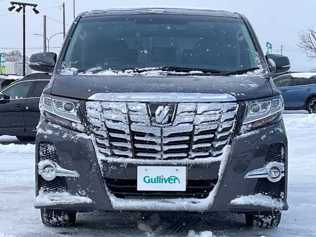 トヨタ アルファード S Cパッケージ 道央・札幌 2015(平27)年 6.9万km グレーメタリック ４WD/JBLプレミアムサウンド/純正メモリーナビ/AM/FM/BT/SD/CD/フルセグ/純正フリップダウンモニター/トヨタセーフティセンス/衝突被害軽減ブレーキ/横滑り防止装置/レーダークルーズコントロール/レーンキープアシスト/パーキングアシスト/クリアランスソナー/バックカメラ/ビルトインETC/ドライブレコーダー/アイドリングストップ/ECOMODE/両側パワースライドドア/パワーバックドア/前席/2列目パワーシート/D席メモリーシート/N席/2列目オットマン/ハーフレザーシート/革巻きウッドコンビステアリング/ステアリングリモコン/ハンドルヒーター/AC100V/電動パーキング/ブレーキホールド/自動防眩ミラー/MTモード付AT/プッシュスタート/スマートキー/LEDヘッドライト/オートライト/フォグランプ/電動格納ミラー/ウィンカーミラー/純正フロアマット/ドアバイザー/スペアキー