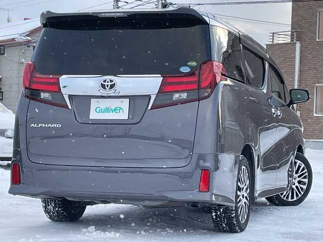 トヨタ アルファード S Cパッケージ 道央・札幌 2015(平27)年 6.9万km グレーメタリック ４WD/JBLプレミアムサウンド/純正メモリーナビ/AM/FM/BT/SD/CD/フルセグ/純正フリップダウンモニター/トヨタセーフティセンス/衝突被害軽減ブレーキ/横滑り防止装置/レーダークルーズコントロール/レーンキープアシスト/パーキングアシスト/クリアランスソナー/バックカメラ/ビルトインETC/ドライブレコーダー/アイドリングストップ/ECOMODE/両側パワースライドドア/パワーバックドア/前席/2列目パワーシート/D席メモリーシート/N席/2列目オットマン/ハーフレザーシート/革巻きウッドコンビステアリング/ステアリングリモコン/ハンドルヒーター/AC100V/電動パーキング/ブレーキホールド/自動防眩ミラー/MTモード付AT/プッシュスタート/スマートキー/LEDヘッドライト/オートライト/フォグランプ/電動格納ミラー/ウィンカーミラー/純正フロアマット/ドアバイザー/スペアキー