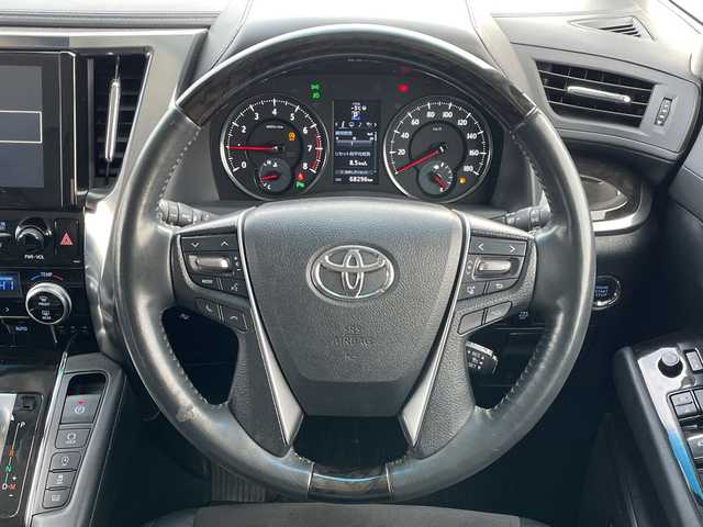 トヨタ アルファード S Cパッケージ 道央・札幌 2015(平27)年 6.9万km グレーメタリック ４WD/JBLプレミアムサウンド/純正メモリーナビ/AM/FM/BT/SD/CD/フルセグ/純正フリップダウンモニター/トヨタセーフティセンス/衝突被害軽減ブレーキ/横滑り防止装置/レーダークルーズコントロール/レーンキープアシスト/パーキングアシスト/クリアランスソナー/バックカメラ/ビルトインETC/ドライブレコーダー/アイドリングストップ/ECOMODE/両側パワースライドドア/パワーバックドア/前席/2列目パワーシート/D席メモリーシート/N席/2列目オットマン/ハーフレザーシート/革巻きウッドコンビステアリング/ステアリングリモコン/ハンドルヒーター/AC100V/電動パーキング/ブレーキホールド/自動防眩ミラー/MTモード付AT/プッシュスタート/スマートキー/LEDヘッドライト/オートライト/フォグランプ/電動格納ミラー/ウィンカーミラー/純正フロアマット/ドアバイザー/スペアキー