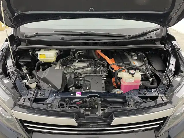 トヨタ ヴォクシー ハイブリッド ZS 煌Ⅱ 千葉県 2017(平29)年 6.4万km ブラッキッシュアゲハガラスフレーク 禁煙車/純正9インチナビ/・NSZT-Y66T/・CD/DVD/BT/フルセグ/純正12.1インチフリップダウンモニター/プリクラッシュセーフティ/車線逸脱警報/先行車発進告知/両側パワースライドドア/バックカメラ/LEDヘッドライト/オートライト/オートハイビーム/ロールサンシェイド/スマートキー/スペアキー/純正ビルトインETC