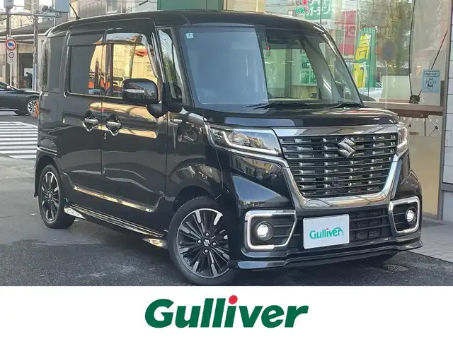 スズキ スペーシア カスタム HYBRID XS ターボ 愛知県 2018(平30)年 7万km ブルーイッシュブラックパール3 IC付ターボ/両側パワースライドドア/純正メモリナビ〈CN-RZ83〉/・DVD／Bluetooth／地デジTV/パノラミックビューモニター/クルーズコントロール/ヘッドアップディスプレ/合皮＆ファブリックコンビシート/運転席シートヒーター/LEDヘッドライト＆フォグランプ/サイドスポイラー＆リアスポイラー/エコクール／リアヒーターダクト/後席左右パーソナルテーブル/スズキセーフティサポート/・デュアルセンサーブレーキサポート/・誤発進抑制機能/・車線逸脱警報/・ふらつき警報/・先行車発進告知機能/・リアパーキングセンサー/ビルトインETC/GPSレーダー〈GWR81sd〉/前方ドライブレコーダー〈DRV517S〉/スマートキー＆プッシュスタート/純正15インチAW
