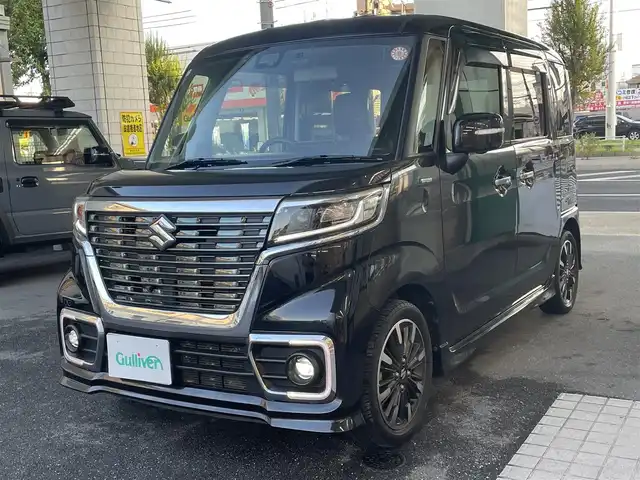 スズキ スペーシア カスタム HYBRID XS ターボ 愛知県 2018(平30)年 7万km ブルーイッシュブラックパール3 IC付ターボ/両側パワースライドドア/純正メモリナビ〈CN-RZ83〉/・DVD／Bluetooth／地デジTV/パノラミックビューモニター/クルーズコントロール/ヘッドアップディスプレ/合皮＆ファブリックコンビシート/運転席シートヒーター/LEDヘッドライト＆フォグランプ/サイドスポイラー＆リアスポイラー/エコクール／リアヒーターダクト/後席左右パーソナルテーブル/スズキセーフティサポート/・デュアルセンサーブレーキサポート/・誤発進抑制機能/・車線逸脱警報/・ふらつき警報/・先行車発進告知機能/・リアパーキングセンサー/ビルトインETC/GPSレーダー〈GWR81sd〉/前方ドライブレコーダー〈DRV517S〉/スマートキー＆プッシュスタート/純正15インチAW