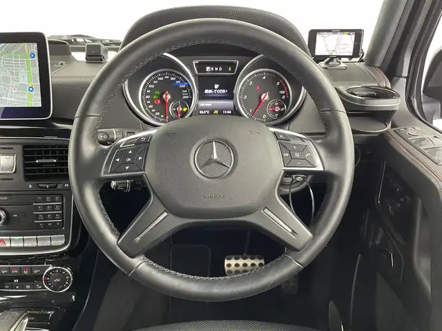 メルセデス・ベンツ ゲレンデヴァーゲン Ｇ３５０ｄ デジーノ マヌファクトゥーアED 大分県 2017(平29)年 3.5万km オブシディアンブラック 200台限定車“designo manufaktur Edition/・ブラックペイント19インチAMG 5スポークアルミホイール/・ブラックアクセント（フロントグリル、ステンレス製スペアタイヤカバー、ドアミラーカバー、サイドストリップ）/・スライディングルーフ/・マルチコントロールシートバック（前席）/・レッドステッチ入designoレザーブラック内装/・designoフロアマット/ harman/kardon ロジック７サラウンドサウンドシステム/4WD/純正ナビ/（CD/DVD/AM/FM/Bluetooth）/バックカメラ/サイドビューカメラ/黒本革シート/前席シートベンチレーション/全後席シートヒーター/前席パワーシート（ポジションメモリー付き）/電動チルトテレスコピックステアリング/前方ドライブレコーダー/ETC/ASSURAレーダー探知機/（AR41GA)/保証書・取扱説明書/スペアキー