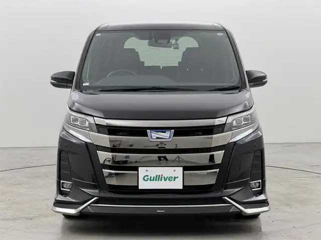 トヨタ ノア ハイブリッド Si ダブルバイビー 福岡県 2018(平30)年 5.1万km ブラック ワンオーナー　/モデリスタエアロ　/アルパイン製後席モニター、９型ナビ　/ＥＴＣ　/ドラレコ　/クルコン　/コーナーセンサー　/衝突被害軽減　/レーンキープ　/オートマチックハイビーム　/両側電動スライドドア　/ハーフレザーシート　/シートヒーター　/純正１６インチＡＷ　/ＬＥＤヘッドライト