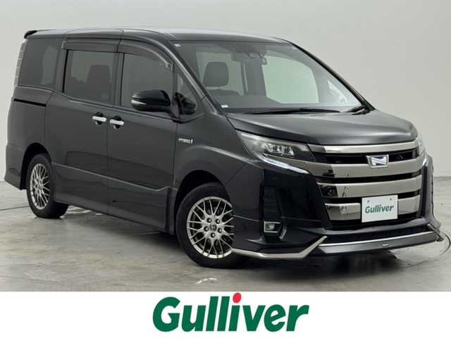 トヨタ ノア ハイブリッド Si ダブルバイビー 福岡県 2018(平30)年 5.1万km ブラック ワンオーナー　/モデリスタエアロ　/アルパイン製後席モニター、９型ナビ　/ＥＴＣ　/ドラレコ　/クルコン　/コーナーセンサー　/衝突被害軽減　/レーンキープ　/オートマチックハイビーム　/両側電動スライドドア　/ハーフレザーシート　/シートヒーター　/純正１６インチＡＷ　/ＬＥＤヘッドライト