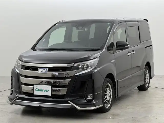 トヨタ ノア ハイブリッド Si ダブルバイビー 福岡県 2018(平30)年 5.1万km ブラック ワンオーナー　/モデリスタエアロ　/アルパイン製後席モニター、９型ナビ　/ＥＴＣ　/ドラレコ　/クルコン　/コーナーセンサー　/衝突被害軽減　/レーンキープ　/オートマチックハイビーム　/両側電動スライドドア　/ハーフレザーシート　/シートヒーター　/純正１６インチＡＷ　/ＬＥＤヘッドライト