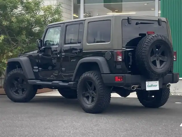 クライスラー・ジープ ジープ ラングラー アンリミテッド スポーツ 岡山県 2014(平26)年 8.1万km ブラック 社外メモリナビ　AVIC-MRZ099/フルセグTV、Bluetooth、CD、DVD、AM、FM/バックカメラ/ETC/リモコンキー/JAOSバトルズリフトアップキット/JAOSバトルズ2本出しマフラー/ダイワオートモビルズ　/トレイルランナーマッドブラックアルミホイール/BFグッドリッチオールテレインブロックタイヤ/クルーズコントロール