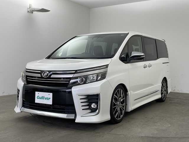 トヨタ ヴォクシー ZS 煌Ⅱ 兵庫県 2017(平29)年 7.2万km ホワイトパールクリスタルシャイン ・ワンオーナー車/・トヨタセーフティーセンス/・プリクラッシュセーフティ/・レーンキープアシスト/・オートハイビーム/・ALPINE製9インチナビ＆フルセグ＆BT＆DVD/・ALPINE製フリップダウンモニター/・両側パワースライドドア/・社外前ドライブレコーダー/・スマートキー/・スペアキー/・プッシュスタート/・ビルトインETC/・アイドリングストップ/・ローダウン/・純正フロアマット/・社外18インチアルミホイール/・電動格納ミラー/・横滑り防止装置/・LEDヘッドライト/・フォグランプ/・オートライト