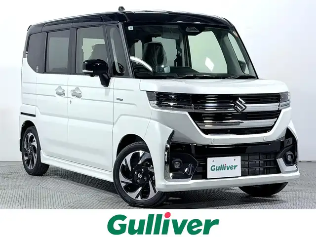 スズキ スペーシア カスタム HYBRID XS 大阪府 2025(令7)年 0.1千km ピュアホワイトパール/ブラック2トーン カスタム HV XS　全方位モニター付きメモリ-ナビゲーション・スズキコネクト対応通信機装着車(195800円)/レーダークルーズコントロール　コーナーセンサー　バックカメラ　レーンアシスト　全方位カメラ　ＬＥＤヘッドライト　プッシュスタート　衝突軽減　純正アルミホイール　フォグランプ　ハンドルヒーター 登録済未使用車 純正大型ナビ 両側電動