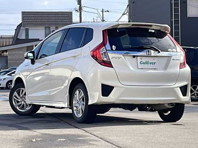 ホンダ フィット ハイブリット Sパッケージ 道北・旭川 2014(平26)年 5万km プレミアムホワイトパール /4WD//禁煙車//純正SDナビ//CD/DVD/SD/BT/フルセグ//バックカメラ//CTBA//クルーズコントロール//パドルシフト//オートライト//LEDヘッドライト//フォグライト//ETC//ミラーヒーター//フロントデアイサー//横滑り防止//純正フロアマット//社外AWサマータイヤ積み込み