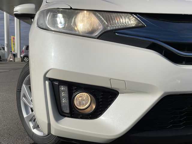 ホンダ フィット ハイブリット Sパッケージ 道北・旭川 2014(平26)年 5万km プレミアムホワイトパール /4WD//禁煙車//純正SDナビ//CD/DVD/SD/BT/フルセグ//バックカメラ//CTBA//クルーズコントロール//パドルシフト//オートライト//LEDヘッドライト//フォグライト//ETC//ミラーヒーター//フロントデアイサー//横滑り防止//純正フロアマット//社外AWサマータイヤ積み込み