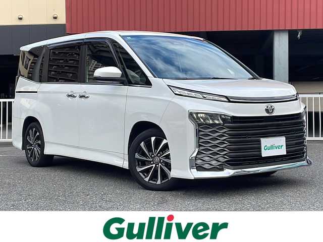 トヨタ ヴォクシー S－Z 神奈川県 2022(令4)年 6.5万km ホワイトパールクリスタルシャイン ワンオーナー				/純正10.5インチメモリーナビ			/・DTV/SD/CD/DVD/BT/HDMI			/バックカメラ/クリアランスソナー/ハーフレザーシート/前席シートヒーター/D席シートリフター/ビルトインETC2.0/ToyotaSafetySense/・アダプティブハイビームシステム/・オートマチックハイビーム/・プリクラッシュセーフティー/・レーントレーシングアシスト/・レーンディパーチャーアラート				/・発進遅れ告知機能/・ロードサインアシスト/・レーダークルーズコントロール/両側パワースライドドア/後席用サンシェード/前後ドライブレコーダー/純正17インチAW	/オートライト/純正LEDヘッドライト				/フォグランプ			/プッシュEgスタート/ストップ			/スマートキー×2	/純正フロアマット/取扱説明書/マルチメディア取扱説明書				/新車時保証書