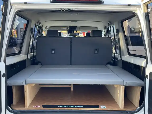 トヨタ ランドクルーザー AX 群馬県 2024(令6)年 3.4万km スーパーホワイトⅡ 7インチディスプレイオーディオ/バックカメラ/純正16インチアルミホイール/純正フロアマット/AHB/Bluetooth/スペアキー2本/ダウンヒルアシストコントロール/センターデフロック/寒冷地仕様/パワーステアリング/ETC/ターボ/４WD/電動格納ミラー/本革ステアリング/デジタルミラー