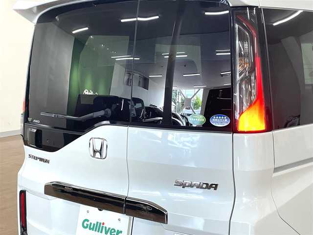 ホンダ ステップワゴン スパーダ クルスピセンシング 道央・札幌 2021(令3)年 3.3万km プラチナホワイトパール 4WD/寒冷地仕様/純正9インチナビ/・フルセグTV/CD/DVD/BT/SD/USB/バックカメラ/両側パワースライドドア/ハーフレザーシート/前席シートヒーター/ホンダセンシング/・衝突被害軽減ブレーキ/・誤発進抑制機能/・路外逸脱抑制機能/・先行車発進お知らせ機能/・標識認識機能/横滑り防止装置/アダプティブクルーズコントロール/ビルトインETC2.0/社外ドライブレコーダー/アイドリングストップ/プッシュスタート/スマートキーx2/ウインカーミラー/純正フロアマット/ドアバイザー/ステアリングリモコン/パドルシフト/オートライト/LEDヘッドライト/フォグライト/3列シート/わくわくゲート/純正16インチAW/新車時保証書/取扱説明書/ナビ取扱説明書
