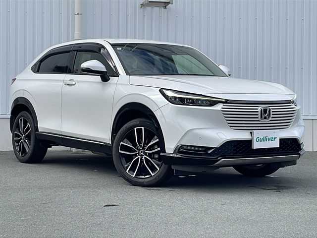 ホンダ ヴェゼル ハイブリッド e:HEV Z 三重県 2021(令3)年 5万km プラチナホワイトパール 純正ナビ/バックカメラ/BSM/前席シートヒーター/ワイヤレス充電器/電子パーキング/前後ドライブレコーダー/ステアリングヒーター/前後コーナーセンサー/デイライト/ビルトインETC2.0/革巻きステアリング/ステアリングリモコン/電動リヤゲート/純正フロアマット/レーダークルーズコントロール/パドルシフト/USB給電ポート/電動格納ミラー/禁煙車