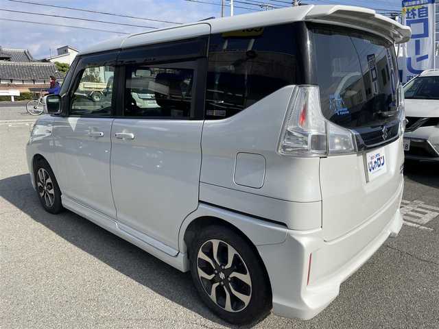 スズキ ソリオ バンディット HV MV Dカメラ ブレーキS 兵庫県 2016(平28)年 9.9万km ピュアホワイトP Ｄ席シートヒーター/純正メモリナビ＆フルセグＴＶ/　（ＤＶＤ＆ＣＤ＆ＢＴ）/バックカメラ/ビルトインＥＴＣ/アイドリングストップ/クルーズコントロール/衝突軽減システム/レーンキープアシスト/２列目サンシェード/盗難防止装置/左側パワースライドドア/純正エアロ/純正１５inアルミホイール/オートライト/ＬＥＤライト/フォグランプ/スマートキー/プッシュスタート/Ｗ＆サイドエアバッグ/横滑り防止装置/ＡＢＳ/ドアバイザー/フロアマット/新車保証書/取扱説明書/スマートスペアキー有