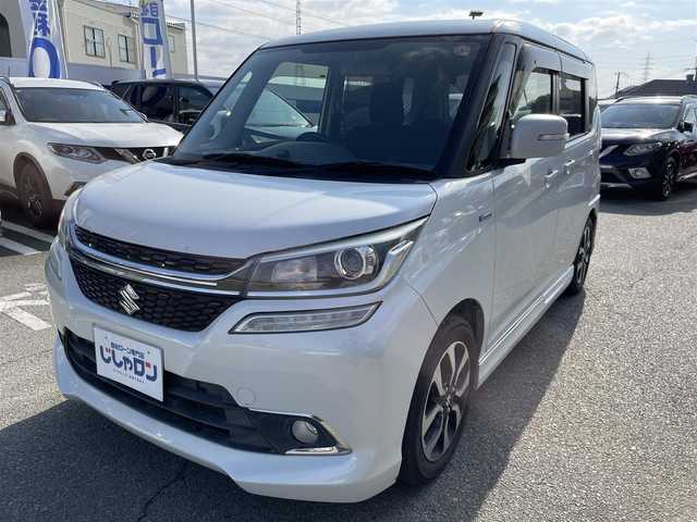 スズキ ソリオ バンディット HV MV Dカメラ ブレーキS 兵庫県 2016(平28)年 9.9万km ピュアホワイトP Ｄ席シートヒーター/純正メモリナビ＆フルセグＴＶ/　（ＤＶＤ＆ＣＤ＆ＢＴ）/バックカメラ/ビルトインＥＴＣ/アイドリングストップ/クルーズコントロール/衝突軽減システム/レーンキープアシスト/２列目サンシェード/盗難防止装置/左側パワースライドドア/純正エアロ/純正１５inアルミホイール/オートライト/ＬＥＤライト/フォグランプ/スマートキー/プッシュスタート/Ｗ＆サイドエアバッグ/横滑り防止装置/ＡＢＳ/ドアバイザー/フロアマット/新車保証書/取扱説明書/スマートスペアキー有