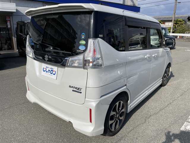 スズキ ソリオ バンディット HV MV Dカメラ ブレーキS 兵庫県 2016(平28)年 9.9万km ピュアホワイトP Ｄ席シートヒーター/純正メモリナビ＆フルセグＴＶ/　（ＤＶＤ＆ＣＤ＆ＢＴ）/バックカメラ/ビルトインＥＴＣ/アイドリングストップ/クルーズコントロール/衝突軽減システム/レーンキープアシスト/２列目サンシェード/盗難防止装置/左側パワースライドドア/純正エアロ/純正１５inアルミホイール/オートライト/ＬＥＤライト/フォグランプ/スマートキー/プッシュスタート/Ｗ＆サイドエアバッグ/横滑り防止装置/ＡＢＳ/ドアバイザー/フロアマット/新車保証書/取扱説明書/スマートスペアキー有