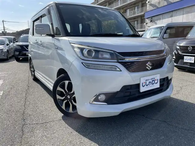 スズキ ソリオ バンディット HV MV Dカメラ ブレーキS 兵庫県 2016(平28)年 9.9万km ピュアホワイトP Ｄ席シートヒーター/純正メモリナビ＆フルセグＴＶ/　（ＤＶＤ＆ＣＤ＆ＢＴ）/バックカメラ/ビルトインＥＴＣ/アイドリングストップ/クルーズコントロール/衝突軽減システム/レーンキープアシスト/２列目サンシェード/盗難防止装置/左側パワースライドドア/純正エアロ/純正１５inアルミホイール/オートライト/ＬＥＤライト/フォグランプ/スマートキー/プッシュスタート/Ｗ＆サイドエアバッグ/横滑り防止装置/ＡＢＳ/ドアバイザー/フロアマット/新車保証書/取扱説明書/スマートスペアキー有