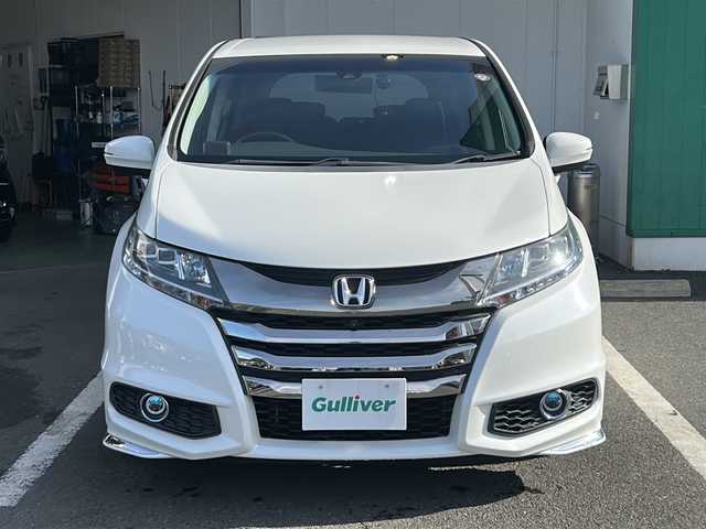 ホンダ オデッセイ ハイブリッド アブソルートセンシングEXパック 京都府 2016(平28)年 7.6万km ホワイトオーキッドパール 純正インターナビ/フルセグ/Bluetooth/ホンダセンシング　/フリップダウンモニター　/全方位カメラ　/両側電動スライドドア　/レーダークルーズ/ブラインドスポットモニター　/禁煙車　/ＥＴＣ　/ドライブレコーダー　/純正アルミ