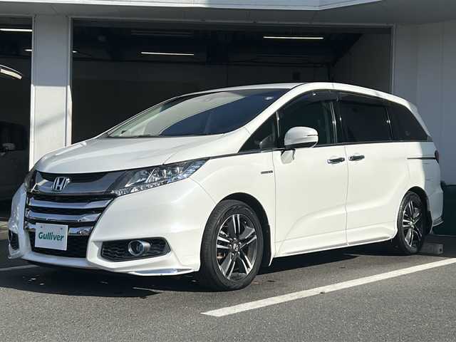 ホンダ オデッセイ ハイブリッド アブソルートセンシングEXパック 京都府 2016(平28)年 7.6万km ホワイトオーキッドパール 純正インターナビ/フルセグ/Bluetooth/ホンダセンシング　/フリップダウンモニター　/全方位カメラ　/両側電動スライドドア　/レーダークルーズ/ブラインドスポットモニター　/禁煙車　/ＥＴＣ　/ドライブレコーダー　/純正アルミ
