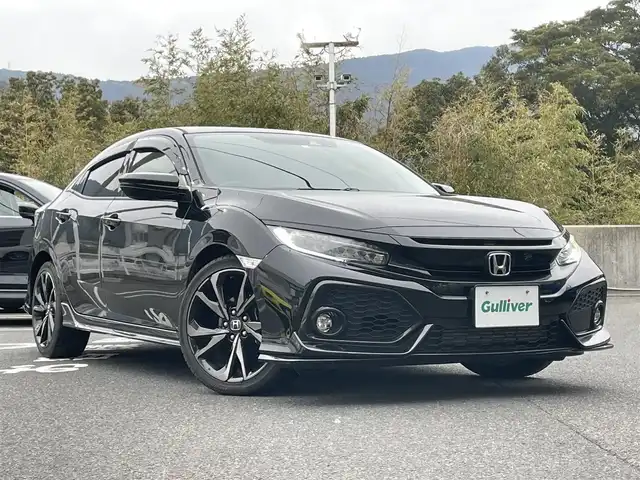 ホンダ シビック ハッチバック 長崎県 2018(平30)年 5.2万km クリスタルブラックパール 純正Gathersナビ/・FM/CD/DVD/BT/フルセグTV/バックカメラ/ドライブレコーダー/シートヒーター/ステアリングスイッチ/革巻きステアリング/電子サイドブレーキ/レーダークルーズコントロール/アイドリングストップ/レーンディパーチャーアラート/レーンキープアシスト/パドルシフト/横滑り防止機能