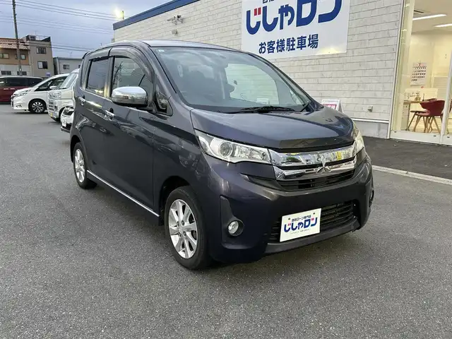 三菱 ｅＫカスタム G 群馬県 2013(平25)年 6.1万km パープリッシュネイビーパール (株)IDOMが運営する【じしゃロン伊勢崎店】の自社ローン専用車両になりますこちらは現金またはオートローンご利用時の価格です。自社ローンご希望の方は別途その旨お申付け下さい/純正ナビ/バックカメラ/スペアキー/純正アルミホイール/冬用タイヤ積載/ドアバイザー/電格ミラー