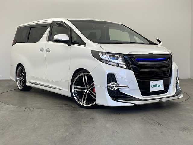 トヨタ アルファード SA 兵庫県 2015(平27)年 4.3万km ホワイトパールクリスタルシャイン ・純正ナビ&Bluetooth&CD&DVD&TV&SD/・純正リアフリップダウンモニター/・ビルトインETC/・バックカメラ/・クルーズコントロール/・前後コーナーセンサー/・オートライト/・オートマチックハイビーム/・LEDヘッドライト/・W＋サイドエアバッグ/・カーテンエアバッグ/・三列シート/・オットマンシート/・前後ドライブレコーダー/・純正フロアマット/・両側パワースライドドア/・社外２１インチアルミホイール/・モデリスタエアロパーツ/・nanoeエアコン/・スマートキー/・WACエアコン/・電動パーキングブレーキ/・ステアリングスイッチ/・ローダウン/・革巻きステアリング