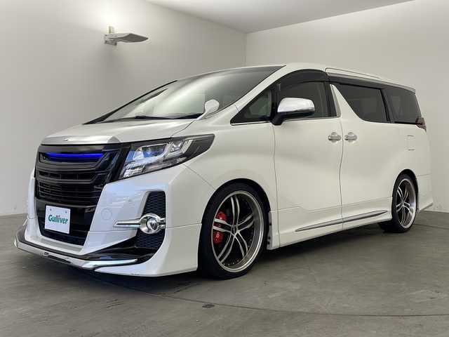 トヨタ アルファード SA 兵庫県 2015(平27)年 4.3万km ホワイトパールクリスタルシャイン ・純正ナビ&Bluetooth&CD&DVD&TV&SD/・純正リアフリップダウンモニター/・ビルトインETC/・バックカメラ/・クルーズコントロール/・前後コーナーセンサー/・オートライト/・オートマチックハイビーム/・LEDヘッドライト/・W＋サイドエアバッグ/・カーテンエアバッグ/・三列シート/・オットマンシート/・前後ドライブレコーダー/・純正フロアマット/・両側パワースライドドア/・社外２１インチアルミホイール/・モデリスタエアロパーツ/・nanoeエアコン/・スマートキー/・WACエアコン/・電動パーキングブレーキ/・ステアリングスイッチ/・ローダウン/・革巻きステアリング