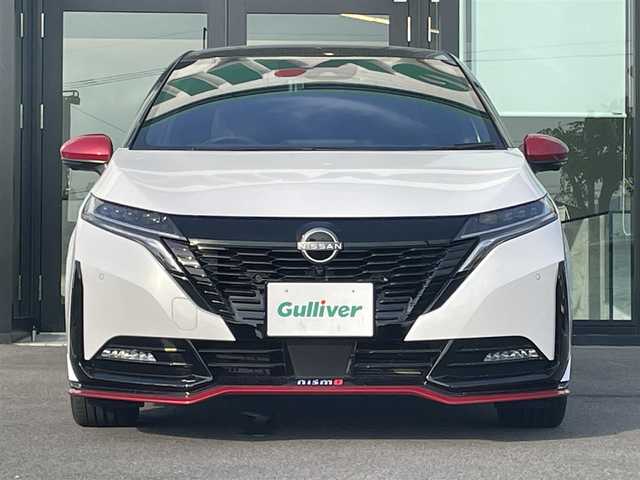 日産 オーラ ニスモ 愛媛県 2022(令4)年 2.2万km ピュアホワイトパール / スーパーブラック 2トーン アラウンドビューモニター/プロパイロット/純正ディスプレイオーディオ/Bluetooth/フルセグTV/ドライブレコーダー/ビルトインETC2.0/ブラインドスポットモニター/衝突被害軽減ブレーキ/レーンキープアシストシステム/前後コーナーセンサー/デジタルインナーミラー/電動パーキングブレーキ/オートホールド/ステアリングリモコン/nisumo専用ハーフレザーシート/置くだけ充電/LEDヘッドライト/オートライト/オートマチックハイビーム/フォグランプ/純正フロアマット/純正17インチアルミホイール/スマートキー/スペアキー１本/プッシュスタート
