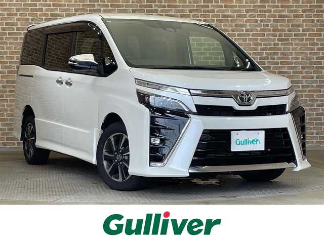 トヨタ ヴォクシー ZS 煌Ⅲ 岩手県 2021(令3)年 9.8万km ホワイトパールクリスタルシャイン ４WD/後席モニター/寒冷地仕様/両側パワースライドドア/クルーズコントロール/レーンアシスト/コーナーセンサー/トヨタセーフティセンス/衝突被害軽減ブレーキ/先行車発進お知らせ機能/エンジンスターター/アイドリングストップ/MT付きAT/９インチ純正ナビ（Bluetooth CD DVD フルセグ）/ETC/横滑り防止装置/オートハイビーム/LEDヘッドライト/フォグランプ/バックカメラ/純正１６インチアルミホイール/3列シート/ウォークスルー