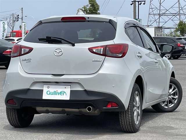 マツダ デミオ 15Sノーブルクリムゾン 道央・札幌 2019(平31)年 2.2万km セラミックM ４WD/純正メーカーナビ/CD/DVD/BT/フルセグ/衝突被害軽減ブレーキ/横滑り防止装置/レーンキープアシスト/クリアランスソナー/ブラインドスポットモニター/アラウンドビューモニター/ETC/ミラー一体型ドライブレコーダー/アイドリングストップ/前席シートヒーター/革巻きステアリング/ステアリングリモコン/MTモード付AT/プッシュスタート/スマートキー/LEDヘッドライト/オートライト/オートハイビーム/電動格納ミラー/ウィンカーミラー/純正フロアマット/ドアバイザー