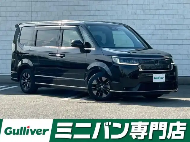 ホンダ ステップワゴン スパーダ eHEV 福岡県 2022(令4)年 4.7万km クリスタルブラックパール ホンダセンシング純正11.4型ナビ（CD/DVD/フルセグ/BT）純正15.6型フリップダウンモニター両側パワースライドドアアダブティプクルーズコントロールアラウンドビューモニターデジタルインナーミラーパワーバックドアハーフレザーシート前席シートヒーターLEDヘッドライトオートライト純正AWパドルシフトETC