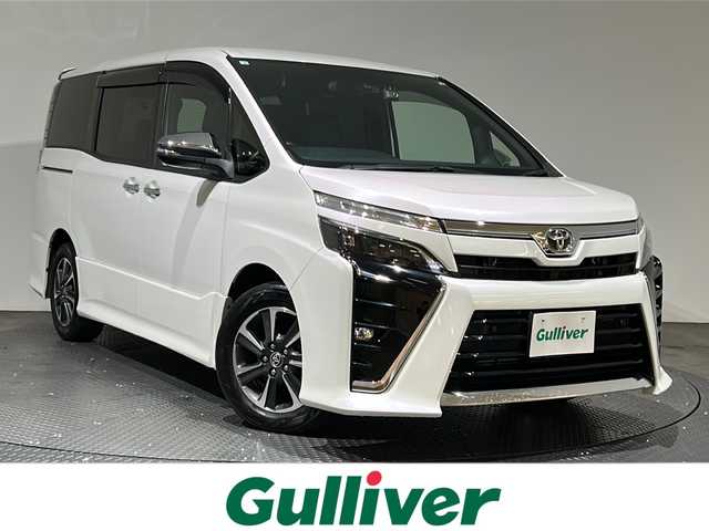 トヨタ ヴォクシー ZS 煌Ⅱ 愛媛県 2020(令2)年 5万km ホワイトパールクリスタルシャイン ・ワンオーナー/・純正ナビ(NSZN-Z68T)/(フルセグ/CD/DVD/BT)/・トヨタセーフティセンス/・純正フリップダウンモニター/・両側パワースライドドア/・バックカメラ/・前後ドライブレコーダー(DC-DR652)/・サイドサンシェード/・純正16インチアルミホイール/・純正フロアマット/・革製シートカバー/・ステアリングリモコン/・ドアバイザー/・ビルトインETC/・スペアキー/・取扱説明書/・保証書