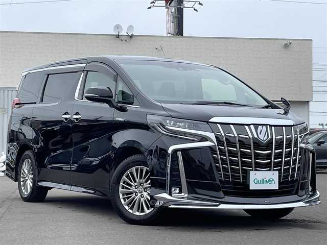 トヨタ アルファードハイブリット SR 道東・釧路十勝 2019(平31)年 6.4万km ブラック 4WD/MODELLISTAエアロ/Toyota Safety Sense/・PCS(プリクラッシュセーフティ)/・LTA(レーントレーシングアシスト)/・オートマチックハイビーム/・レーダークルーズコントロール/純正ディーラーOPメモリナビ/ (CD/DVD/BT/HDMI)/フルセグTV/バックカメラ/純正フリップダウンモニター/ビルトインETC/純正前後ドライブレコーダー/ウッドコンビステアリング/ステアリングスイッチ/レザーシート/パワーシート/ (運転席/助手席)/メモリーシート/ (運転席)/シートヒータ/ (運転席/助手席)/エアーシート/ (運転席/助手席)/オットマン/プッシュスタート/スマートキー/スペアキー/純正17インチAW/両側パワースライドドア/サイドステップ/純正二眼LEDヘッドライト/フォグランプ/ウインカーミラー/電動格納ミラー/横滑り防止装置/アイドリングストップ/保証書