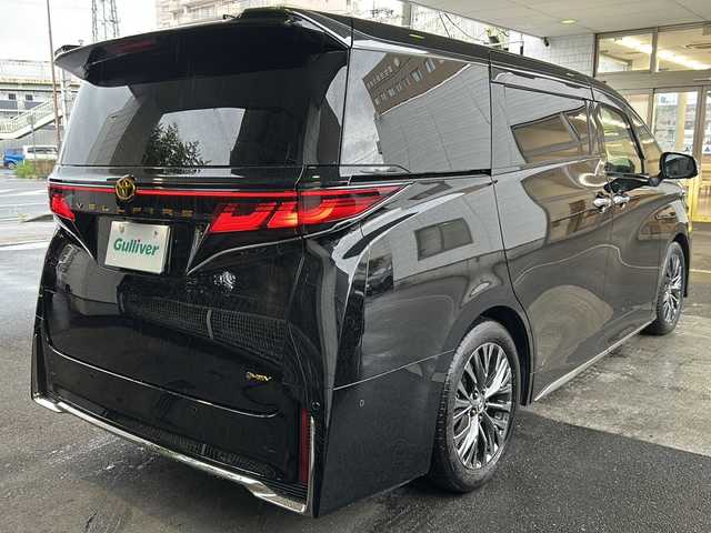 トヨタ ヴェルファイア ハイブリット Z プレミア 京都府 2023(令5)年 2.4万km ブラック 左右独立ムーンルーフ　/茶本革シート　/オットマン/シートヒーター/エアシート/メモリーパワーシート/モデリスタイルミネーションパネル　/純正メモリーナビ/フルセグTV/１３．２型有機ＥＬディスプレイフリップダウンモニター(V13T-R72F)/Bluetooth/USB入力端子/全方位カメラ　/ＨＵＤ　/ＢＳＭ /PKSB /RSA /RCTA /3眼LEDライト/ウィンカーミラー/デジタルインナーミラー/フロントフォグランプ/両側パワースライドドア/前方ドライブレコーダー(DRY-ST1700)/パドルシフト/ステアリングスイッチ/ステアリングヒーター/電動パーキングブレーキ/オートホールド/純正ドアバイザー