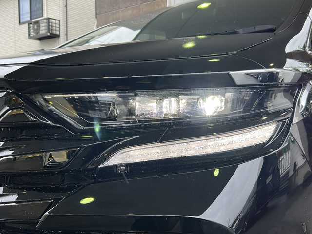 トヨタ ヴェルファイア ハイブリット Z プレミア 京都府 2023(令5)年 2.4万km ブラック 左右独立ムーンルーフ　/茶本革シート　/オットマン/シートヒーター/エアシート/メモリーパワーシート/モデリスタイルミネーションパネル　/純正メモリーナビ/フルセグTV/１３．２型有機ＥＬディスプレイフリップダウンモニター(V13T-R72F)/Bluetooth/USB入力端子/全方位カメラ　/ＨＵＤ　/ＢＳＭ /PKSB /RSA /RCTA /3眼LEDライト/ウィンカーミラー/デジタルインナーミラー/フロントフォグランプ/両側パワースライドドア/前方ドライブレコーダー(DRY-ST1700)/パドルシフト/ステアリングスイッチ/ステアリングヒーター/電動パーキングブレーキ/オートホールド/純正ドアバイザー