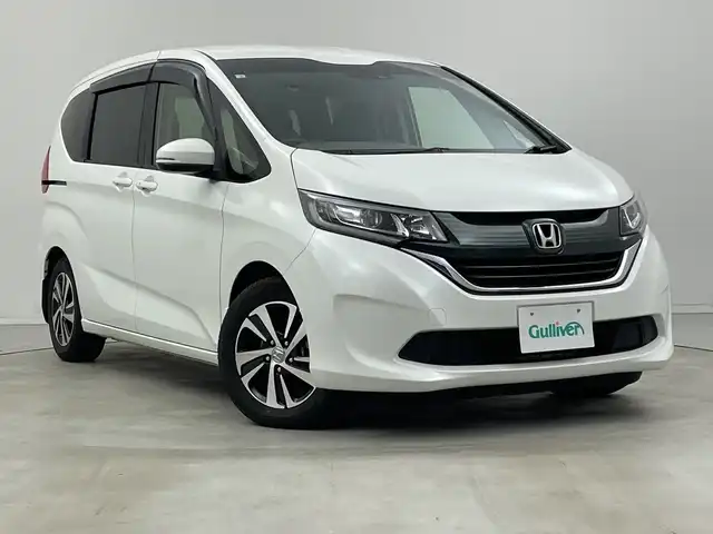 ホンダ フリード G ホンダセンシング 新潟県 2017(平29)年 2.3万km ホワイトオーキッドパール 純正ナビ/ワンセグTV/Bluetooth/CD/DVD//バックカメラ/両側パワースライドドア/3列シート/ETC/純正フロアマット/純正アルミホイール/LEDヘッドライト/プッシュスタート/スマートキー/スペアキー