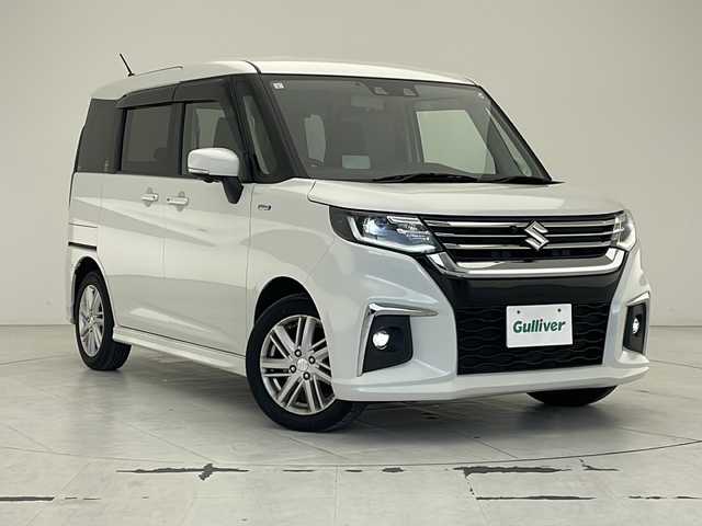 スズキ ソリオ HV MZ 沖縄県 2021(令3)年 1.7万km ピュアホワイトP 純正9インチナビ　/フルセグＴＶ　/DVD/Ｂｌｕｅｔｏｏｔｈ　/ＵＳＢ入力端子　/ＥＴＣ　/全方位モニター　/両側パワースライドドア　/クルーズコントロール　/シートヒーター　/オートライト　/ＬＥＤヘッドライト/電格ミラー　/コーナーセンサー　/スマートキー/プッシュスタート/純正フロアマット/純正15インチアルミホイール