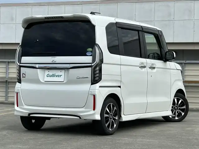 ホンダ Ｎ ＢＯＸ カスタム G EX ホンダセンシング 静岡県 2019(令1)年 1.9万km プラチナホワイトパール ホンダセンシング/・衝突軽減ブレーキ/・誤発進抑制機能/・アダクティブクルーズコントロール/・歩行者事故低減ステアリング/・先行車発進お知らせ機能/・車線維持支援システム/・オートハイビーム/・標識認識機能/・路外逸脱抑制機能/純正SDナビ/（FM/AM/CD/DVD/Bluetooth）/プッシュスタート/片側電動スライドドア/バックカメラ/オートライト/オートハイビーム/ビルトインETC/純正14AW/LEDヘッドライト/ウィンカーミラー/電動格納ミラー