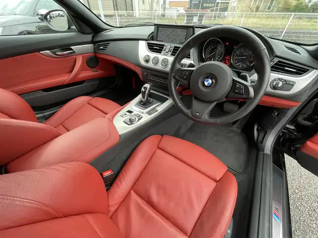 ＢＭＷ Ｚ４ sDrive20i 静岡県 2012(平24)年 1.8万km 黒 電動オープン/レッドレザー/Mスポーツパッケージ/・Mスポーツエアサスペンション/・スポーツレザーステアリングホイール/・アンソラジットルーフライニング/・Mライトアロイホイールスタースポークスタイリング/・スポーツシート/・アルミニウムカーボンインテリアトリム/・ドアシルプレート/・Mフットレスト/シートヒーター/純正ナビ/(FM/AM/AUX/CD/DVD)/ESC/HIDライト/純正18インチアルミホイール/純正フロアマット/オートライト/ETC/保証書/取扱説明書