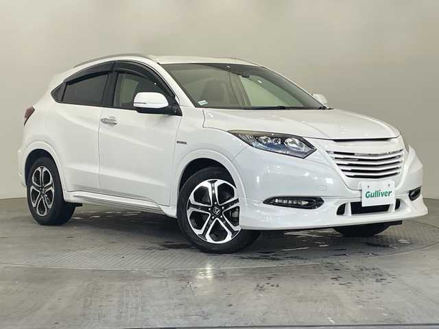 ホンダ ヴェゼル ハイブリッド 栃木県 2016(平28)年 4万km ホワイトオーキッドパール 社外グリル/純正ナビ(VXM-174VFXi)/(フルセグTV・Bluetooth・CD・DVD・USB)/バックカメラ/クルーズコントロール/ドライブレコーダー/ハーフレザーシート/前席シートヒーター/パドルシフト/電動パーキングブレーキ/オートホールド/電動格納ミラー/ドアバイザー/LEDヘッドライト/オートライト/フロントフォグランプ/プッシュスタート/スマートキー