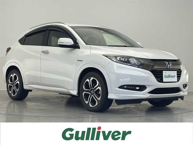 ホンダ ヴェゼル ハイブリッド Z ホンダセンシング 滋賀県 2016(平28)年 7.1万km ホワイトオーキッドパール 禁煙車/純正ナビ/【CD/DVD/Bluetooth/フルセグ/USB/HDMI】/バックカメラ/ビルトインETC/ハーフレザーシート/前席シートヒーター/レーダークルーズコントロール/レーンキープアシスト/ブレーキホールド/プッシュスタート/スマートキー/ステアリングスイッチ