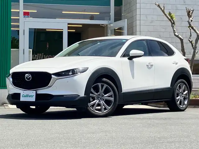 マツダ ＣＸ－３０ XD Lパッケージ 静岡県 2020(令2)年 2.6万km スノーフレイクホワイトパールマイカ エンジンスタートボタン/パワーステアリング/パワーウィンドウ/取扱説明書/パドルシフト/オートエアコン/スマートキー/スペアキー１本/クルーズコントロール/アイドリングストップ/USB入力端子/ETC/全方位カメラ/純正ナビ（CD/DVD/BT/フルセグ）/電動リアゲート/純正フロアマット/D席パワーシート/D席N席シートヒーター/純正アルミホイール/ABS/横滑り防止装置/コーナーセンサー前後/レーンキープアシスト/オートライト/オートマチックハイビーム/LEDヘッドライト/W＋サイドエアバック/衝突軽減システム/BOSEスピーカー/ステアリングヒーター