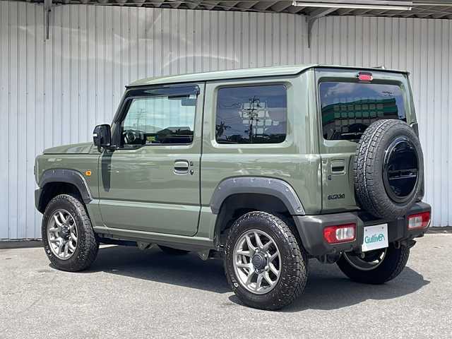スズキ ジムニー XC 長野県 2025(令7)年 0.3万km ジャングルグリーン スズキセーフティサポート /ワンオーナー /オーバーフェンダー/純正１６イン阿智アルミ/TOYOオープンカントリータイヤ/ノーマルタイヤ積込/IPFサイドストレージパネル/リアドアストップダンパー/バイザー