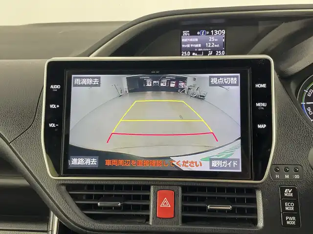 トヨタ ヴォクシー ハイブリッド ZS 煌Ⅱ 愛知県 2019(平31)年 6万km イナズマスパーキングブラックガラスフレーク 禁煙車/純正10インチナビ/（CD/DVD/Bluetooth/フルセグTV/HDMI/USB)/バックカメラ/フリップダウンモニター/トヨタセーフティセンス/・プリクラッシュセーフティ/・レーンディパーチャーアラート/・オートマチックハイビーム/クルーズコントロール/前後ドライブレコーダー/ETC/シートヒーター/両側パワースライドドア/スマートキー/エンジンスターター/プッシュスタート/純正16インチアルミホイール/LEDヘッドライト/フロントフォグランプ/純正フロアマット/横滑り防止装置