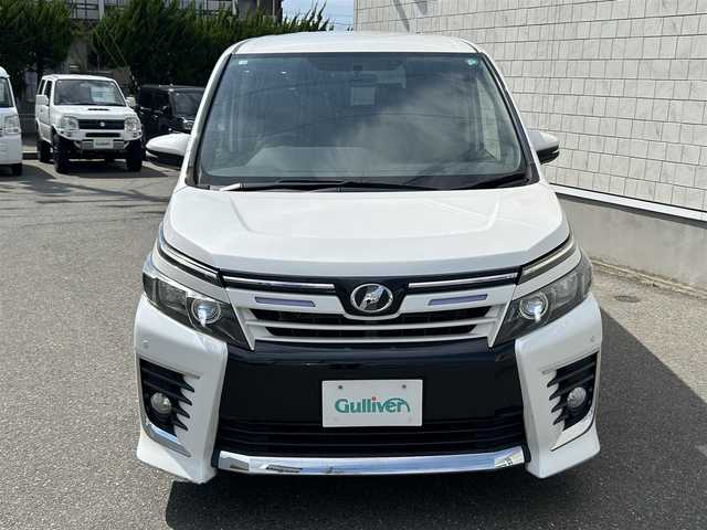 トヨタ ヴォクシー ZS 山形県 2014(平26)年 9.8万km ホワイトパールクリスタルシャイン 4WD/純正9インチナビ・フルセグTV/フリップダウンモニター/両側パワースライドドア/ビルトインET/横滑り防止機能/LEDヘッドライト/スマートキー2個/オートライト/フォグライト/純正16インチアルミホイール/スマートキー/プッシュスタート